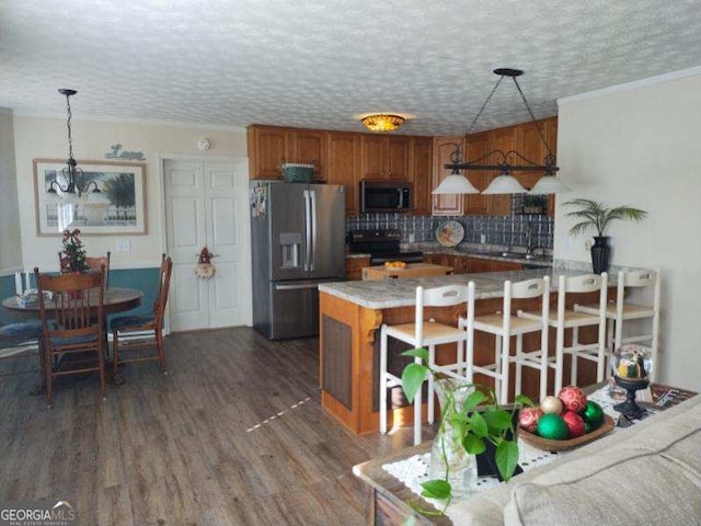 kitchen featuring dark hardwood / wood-style floors, stainless steel refrigerator with ice dispenser, tasteful backsplash, black / electric stove, and decorative light fixtures