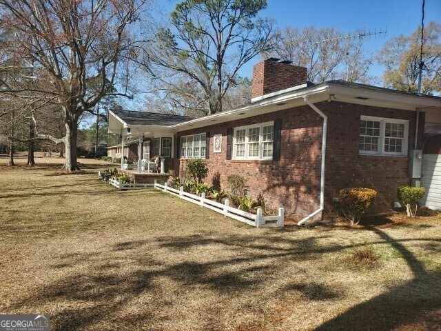 view of property exterior featuring a yard