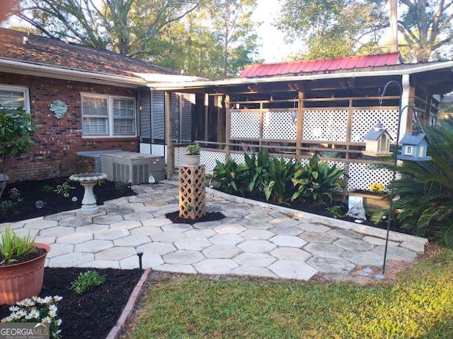 rear view of property featuring a patio area