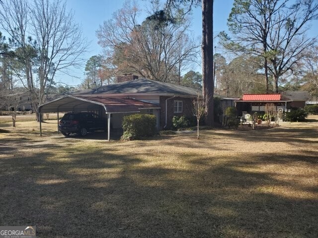 exterior space featuring a carport