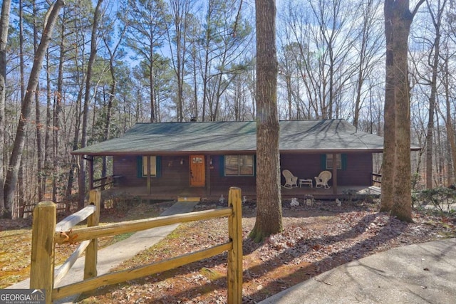 single story home featuring covered porch