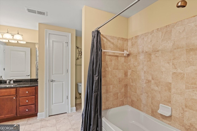 full bathroom with vanity, toilet, tile patterned flooring, and shower / bath combo