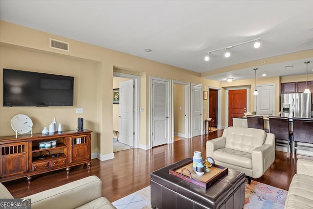 living room with dark hardwood / wood-style flooring