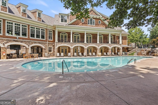 view of pool featuring a patio area