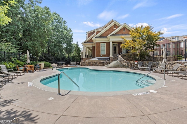 view of pool featuring a patio area