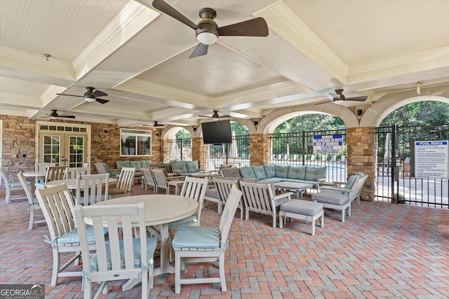 view of patio / terrace featuring an outdoor living space, french doors, and ceiling fan