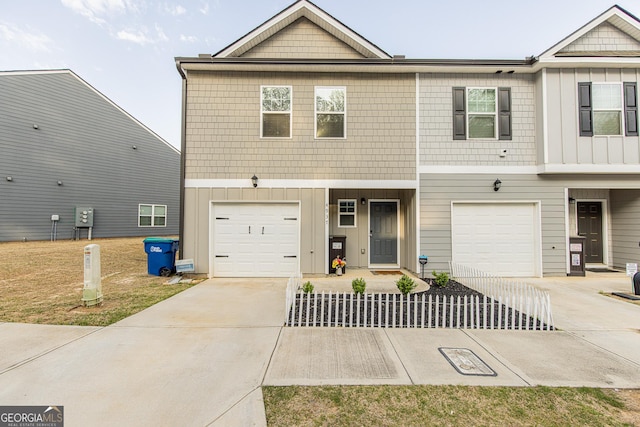 townhome / multi-family property featuring a garage