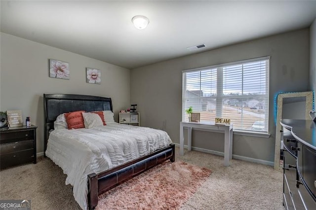 bedroom featuring carpet