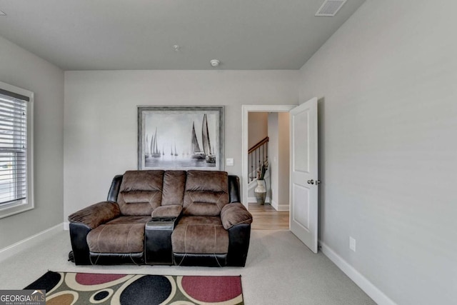 living room featuring light colored carpet