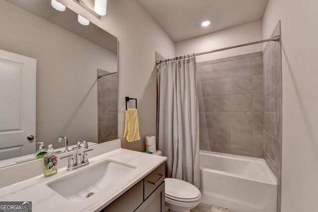 full bathroom with shower / tub combo, vanity, and toilet