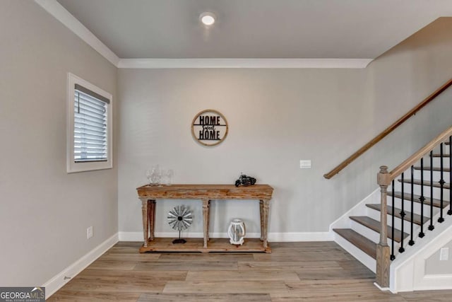 staircase with hardwood / wood-style floors