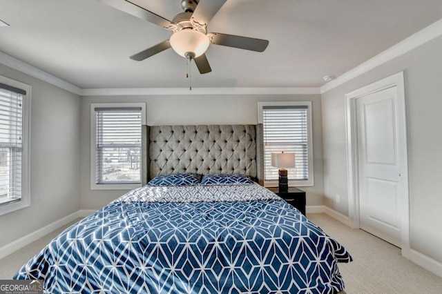 bedroom featuring multiple windows, ornamental molding, and carpet floors