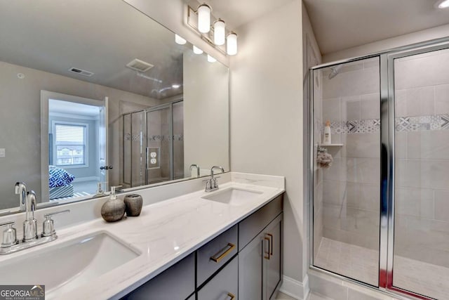 bathroom featuring vanity and a shower with shower door