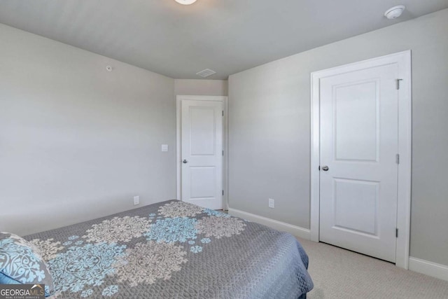 bedroom with light carpet