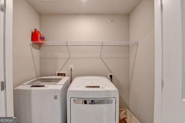 laundry area featuring independent washer and dryer