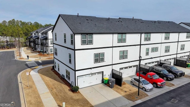 back of property featuring a garage