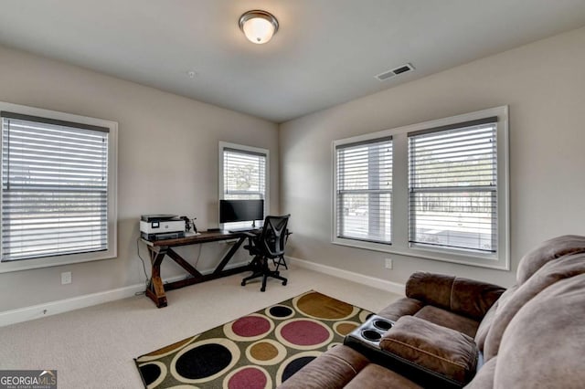 office space with vaulted ceiling and carpet floors