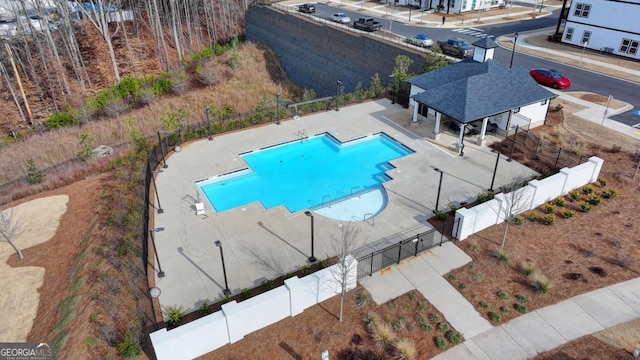 view of swimming pool with a patio