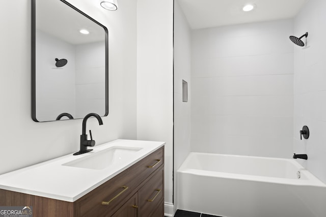 bathroom with shower / bath combination, vanity, and recessed lighting