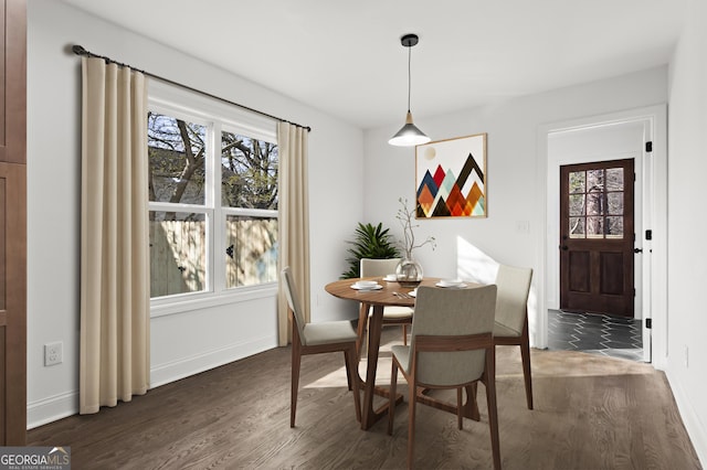 dining room with dark wood-style floors and baseboards