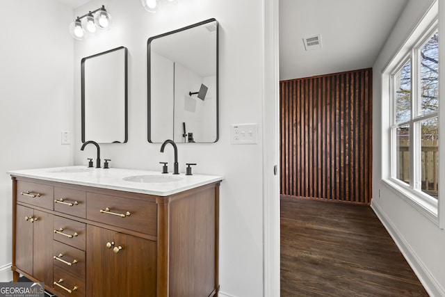 bathroom with vanity and wood-type flooring