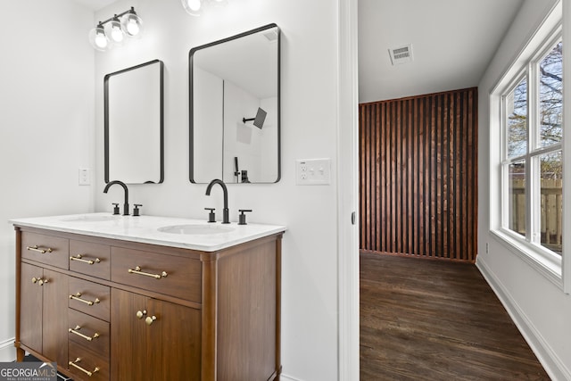 1956 Gober Ave SE, Smyrna, GA 30080 - full bath featuring double vanity, wood finished floors, visible vents, and a sink