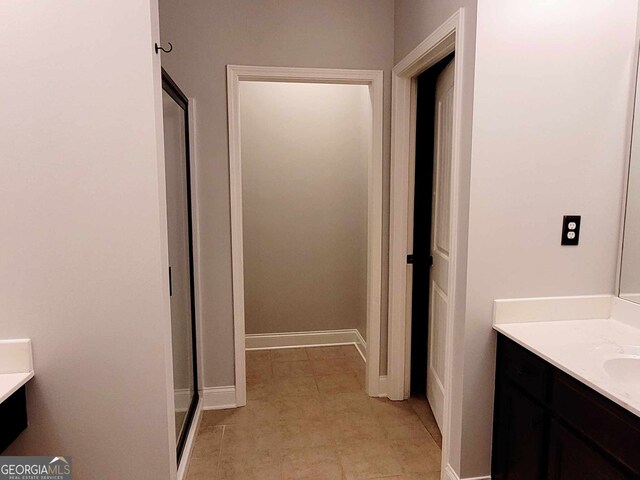 unfurnished bedroom with a raised ceiling, crown molding, light colored carpet, and ceiling fan