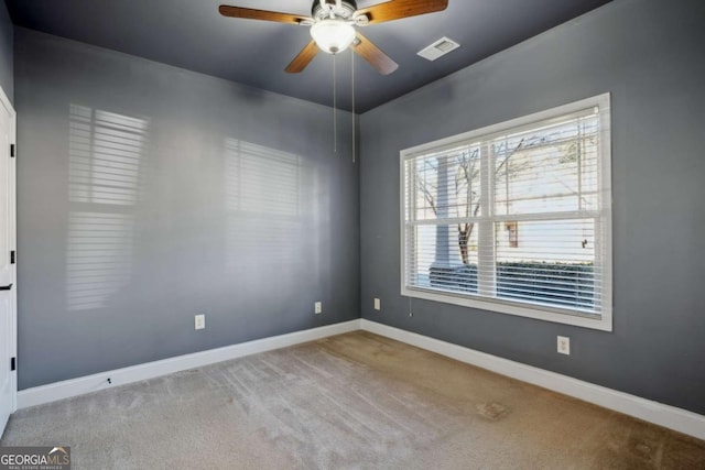 bathroom with ceiling fan, vanity, a raised ceiling, and ornamental molding