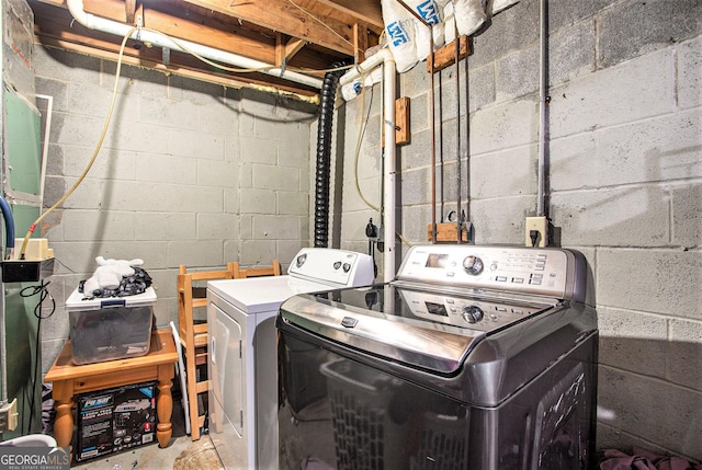 clothes washing area with independent washer and dryer