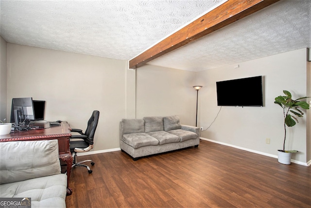 office with beamed ceiling, a textured ceiling, and dark hardwood / wood-style flooring