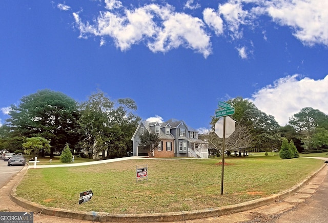 view of home's community with a lawn