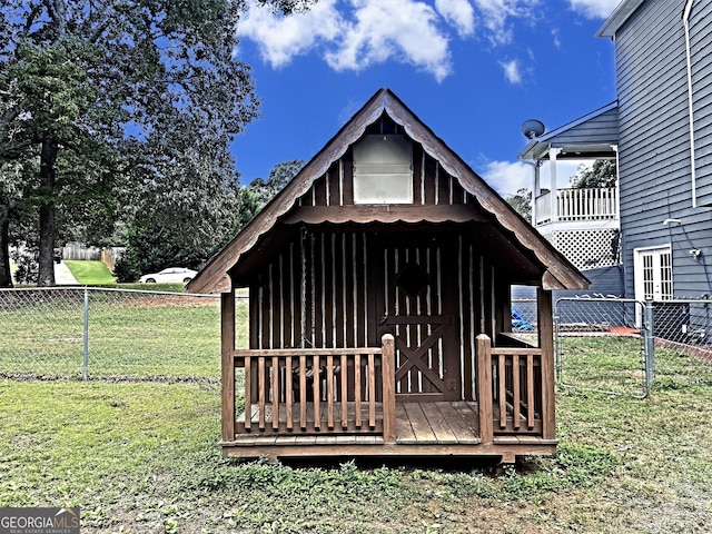 view of outdoor structure featuring a lawn