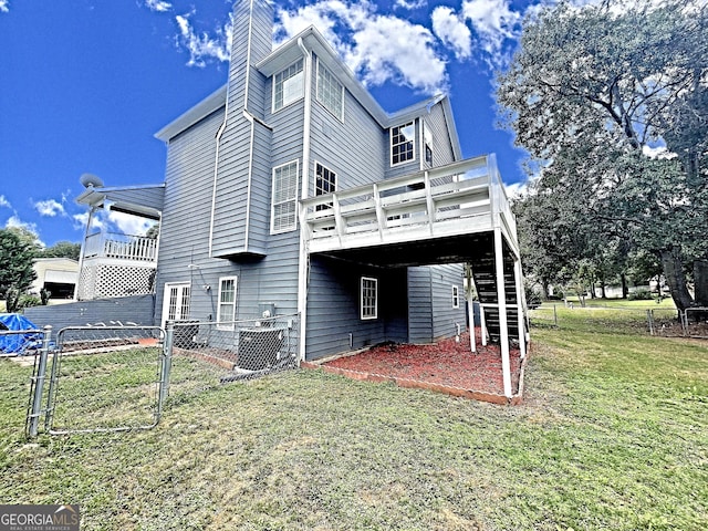 view of property exterior featuring a wooden deck and a lawn