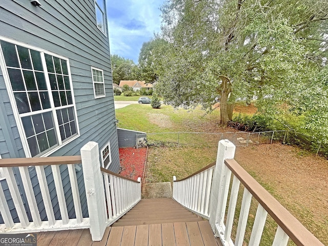 wooden deck with a yard