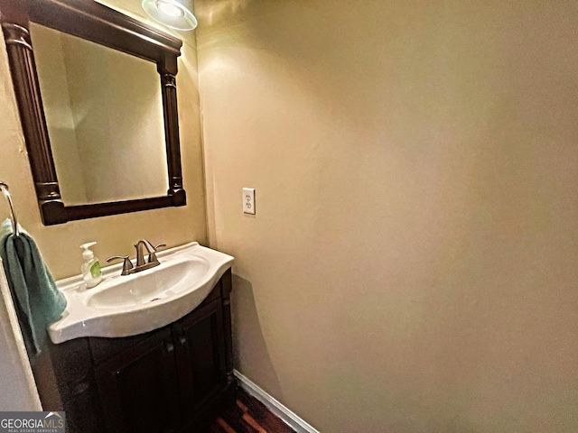 bathroom with baseboards and vanity