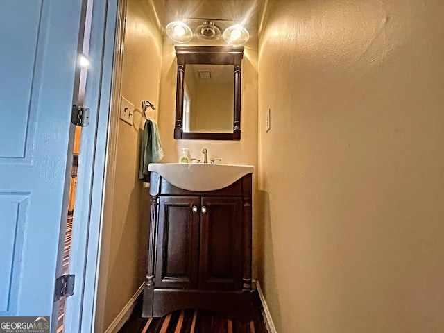 bathroom featuring vanity and baseboards