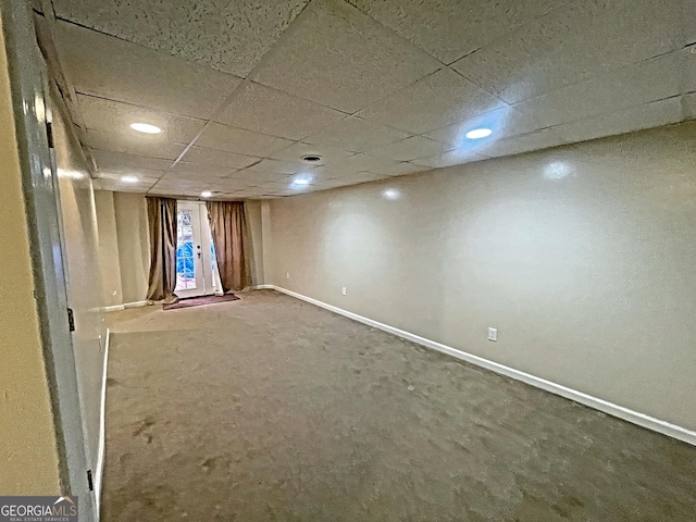 basement featuring a drop ceiling