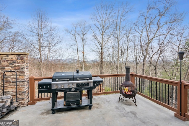 view of patio / terrace featuring grilling area and an outdoor fire pit