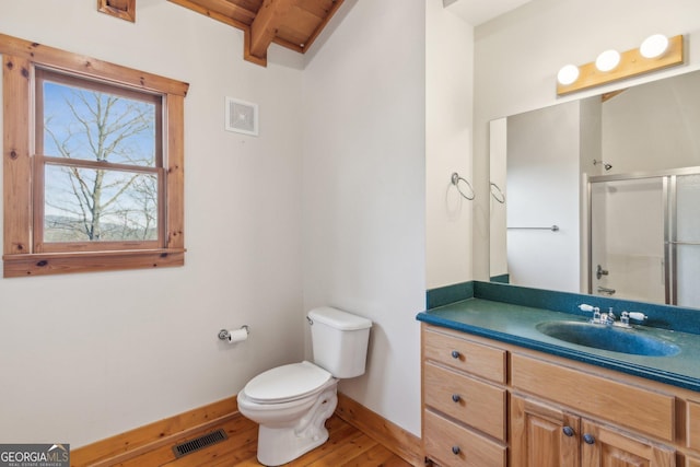 bathroom with walk in shower, toilet, vanity, hardwood / wood-style flooring, and beam ceiling