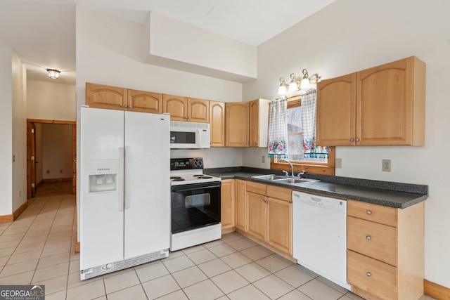 kitchen with light tile patterned flooring, sink, light brown cabinets, and white appliances