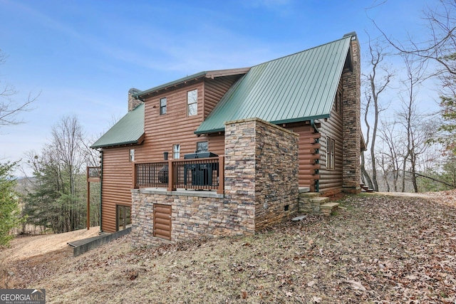 view of property exterior featuring a deck