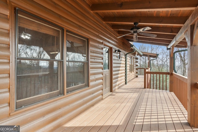 wooden deck featuring ceiling fan