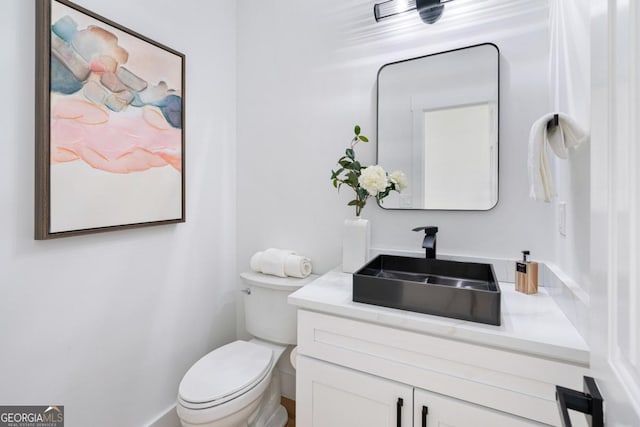 bathroom with vanity and toilet