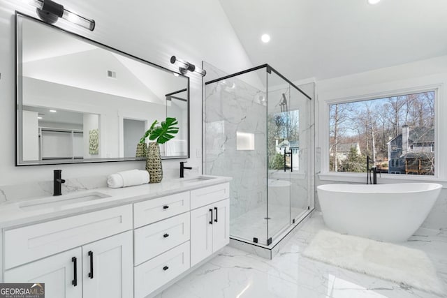 bathroom featuring lofted ceiling, vanity, and separate shower and tub