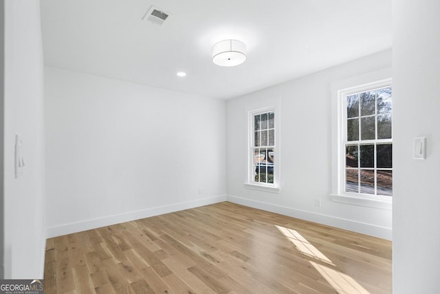 unfurnished room featuring light wood-type flooring