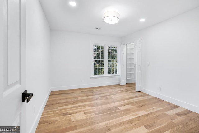 unfurnished room featuring light hardwood / wood-style floors