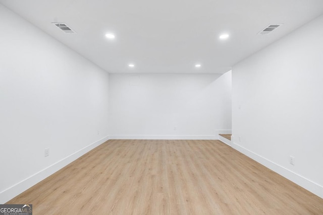 spare room featuring light wood-type flooring