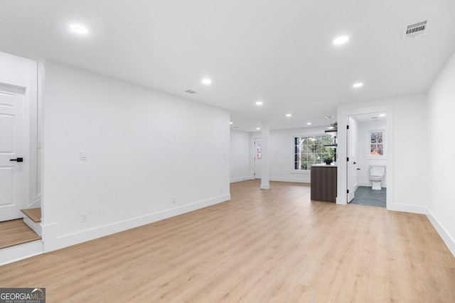 unfurnished living room with light wood-type flooring