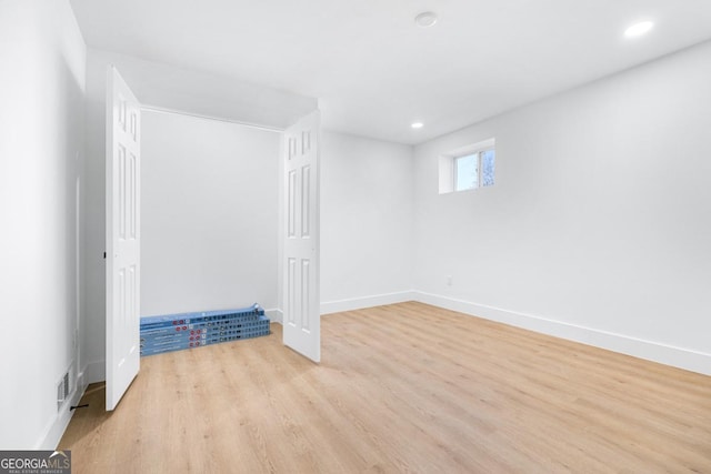 basement featuring light hardwood / wood-style flooring