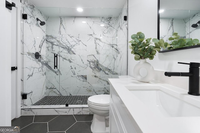 bathroom featuring walk in shower, tile patterned floors, vanity, and toilet